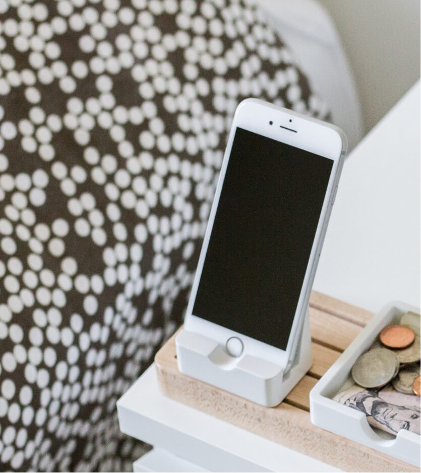 Phone charging on nightstand